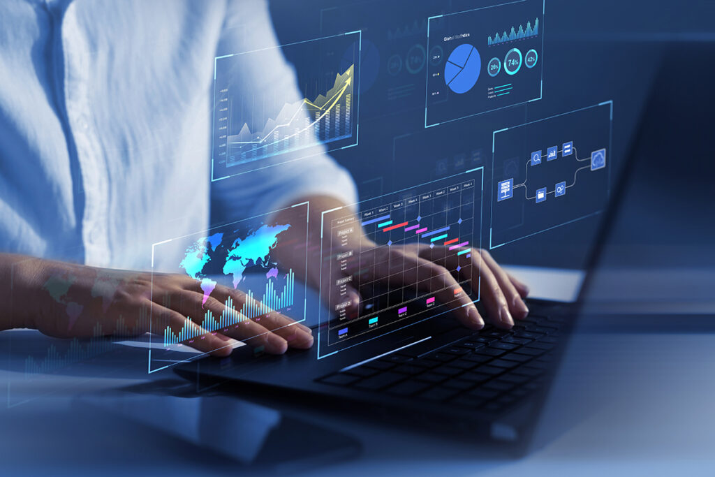 person on laptop with competitive research dashboard icons